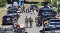 Law enforcement and emergency responders at a park following reports of a shooting.