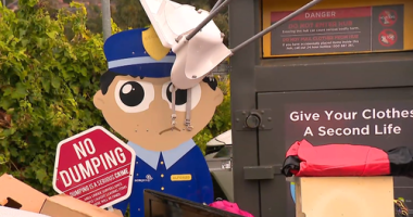 Illegal dumping at a clothing donation bin.