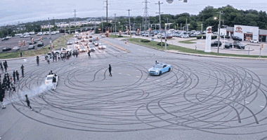 Illegal street takeover shuts down busy intersection with dangerous stunts, fireworks: police