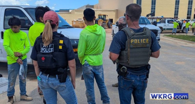 Three detainees wearing neon green shirts in Baldwin County, Alabama