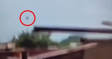 Video still showing an object falling from the sky.