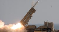 Iranian troops firing a missile during a military exercise.