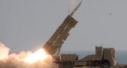 Iranian troops firing a missile during a military exercise.