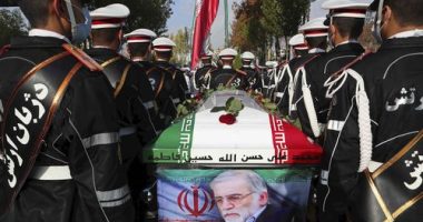 Military personnel stand near the flag-draped coffin of Mohsen Fakhrizadeh during his funeral in Tehran, Iran, in November 2020.