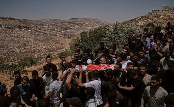 Israeli settlers rampage at a military base in the West Bank
