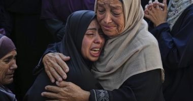 Relatives of Palestinians killed in Israeli strikes on the Gaza Strip mourn their deaths at Al-Shifa Hospital in Gaza City, Saturday, June 28, 2025. (AP Photo/Jehad Alshrafi)