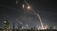 Israelis take cover in bomb shelters as Iran launches wave of missiles