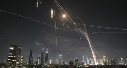 Israelis take cover in bomb shelters as Iran launches wave of missiles