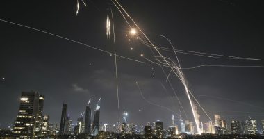 Israelis take cover in bomb shelters as Iran launches wave of missiles
