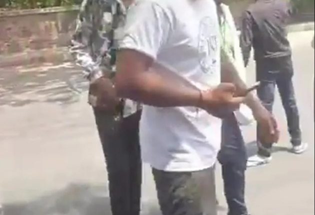 Video still of a man walking away from a crash.