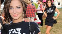 Just in case anyone forgets! Tulisa wears her own The Female Boss T-shirt as she curls new hair on second day of V Festival
