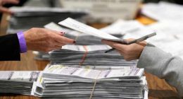 Justice Department's early moves on voting and elections signal a shift from its traditional role