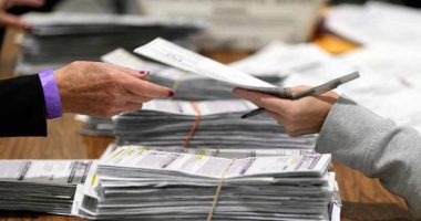 Justice Department's early moves on voting and elections signal a shift from its traditional role