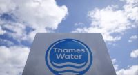 A Thames Water sign against a blue sky with white clouds