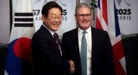 South Korean President Lee Jae-myung and British Prime Minister Keir Starmer shaking hands at a bilateral meeting.