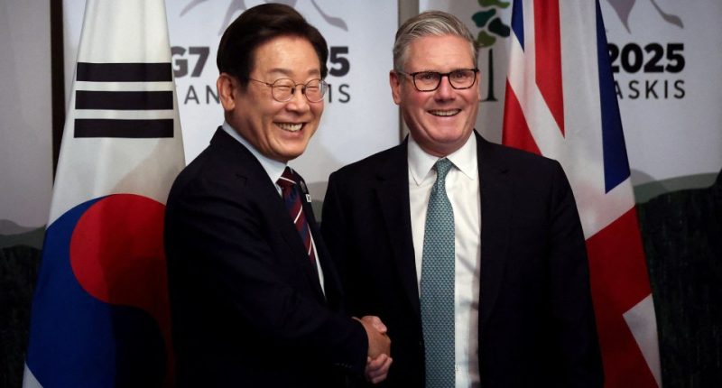 South Korean President Lee Jae-myung and British Prime Minister Keir Starmer shaking hands at a bilateral meeting.