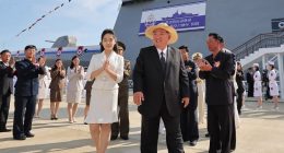 Kim Jong Un and his daughter attending the launch ceremony of a North Korean destroyer.