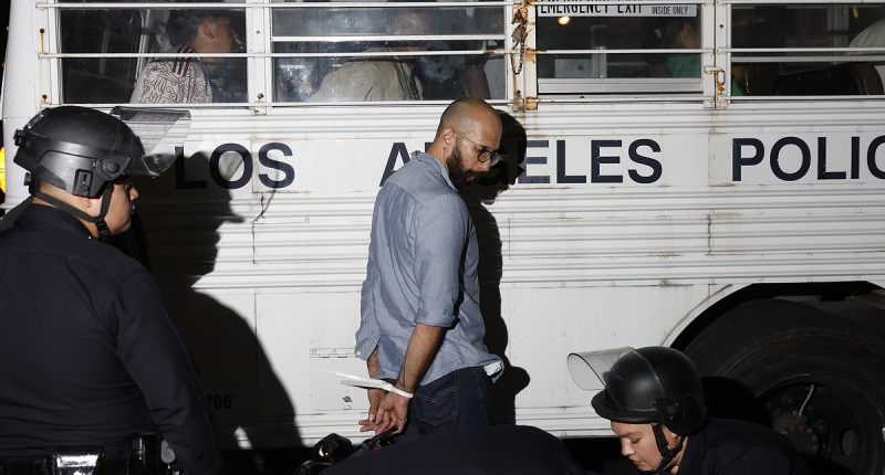LA fights back with protesters zip-tied and loaded onto buses en masse