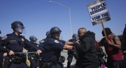 California Highway Patrol officers clash with protesters on Tuesday, June 10, 2025, in Los Angeles. (AP Photo/Eric Thayer)