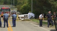 Small plane crash scene on a street near an airport.