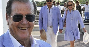 Lilac lovers: Roger Moore and wife Kristina Tholstrup arrive at the 70th Venice Film Festival in colour-coordinated outfits