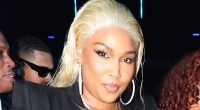 Lizzo showcases her incredible weight loss in a tight leather corset