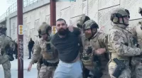 Los Angeles protester charged with throwing rock at federal officer's face shield