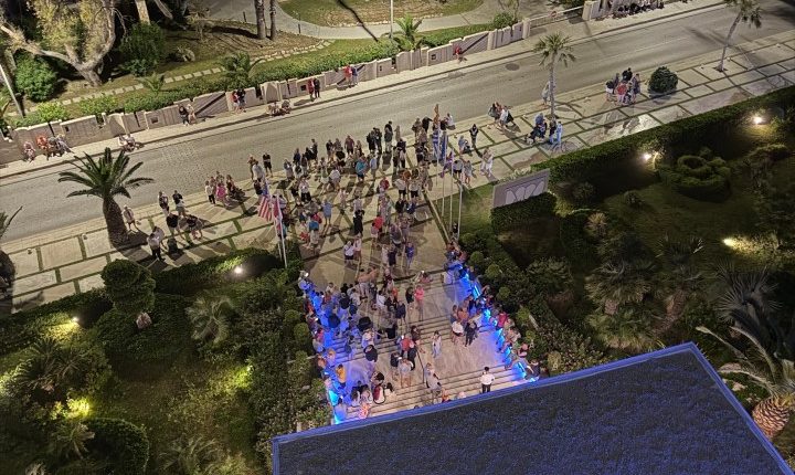 Aerial view of a crowd of people gathered at night.