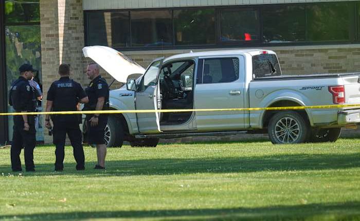 Man's mother is member of church where he opened fire outside before he was fatally shot, police say