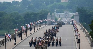 Military parade features helicopter flyover as police in LA disperse protest