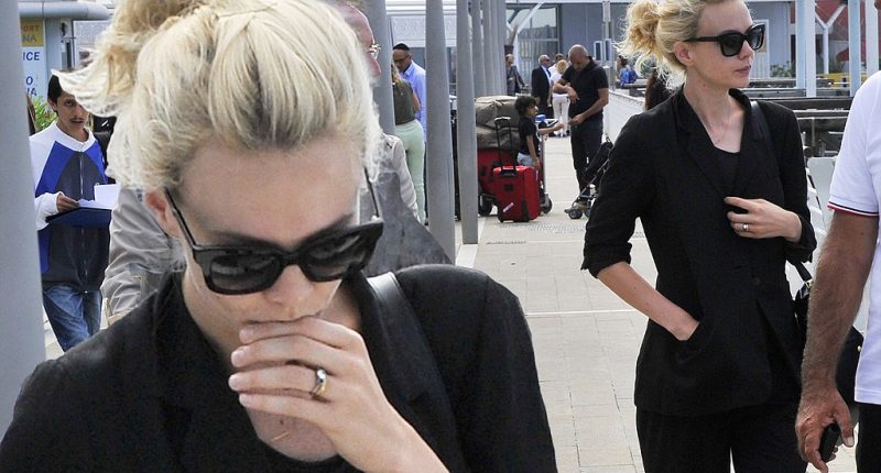 Mulling things over? Carey Mulligan looks deep in thought as she arrives at Venice Film Festival dressed in a chic black suit