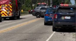 Emergency vehicles at the scene of an active shooter incident outside a church.