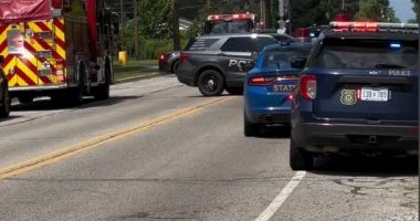 Emergency vehicles at the scene of an active shooter incident outside a church.