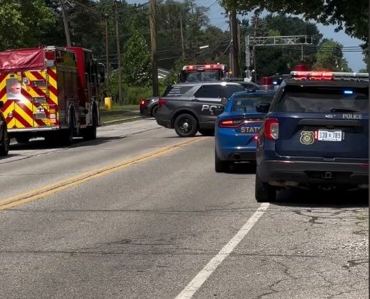 Emergency vehicles at the scene of an active shooter incident outside a church.