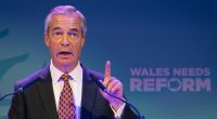 Nigel Farage speaking at a Reform UK event in Port Talbot, Wales.