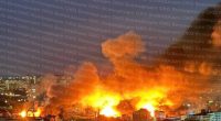 Fire and smoke engulf buildings in Kyiv and Odesa following a Russian attack.