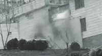 Grainy security camera footage of an explosion at Evin prison in Iran.