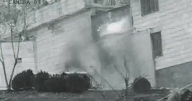 Grainy security camera footage of an explosion at Evin prison in Iran.