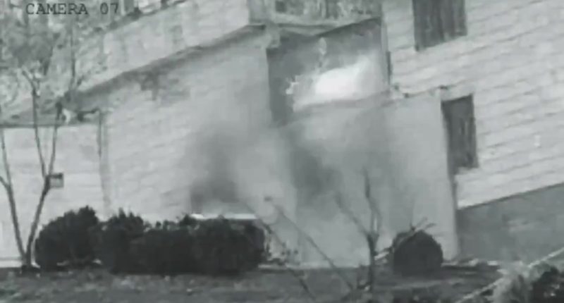 Grainy security camera footage of an explosion at Evin prison in Iran.
