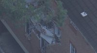 One hospitalised after gas explosion blows wall apart in Sydney apartment block