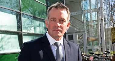 Man in suit outside the Internet Watch Foundation.