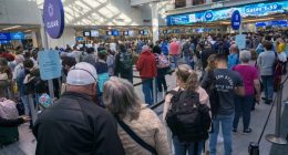 Long security line at a busy airport.