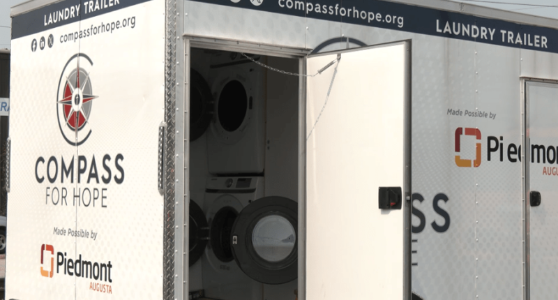 Piedmont Health presenting new laundry trailer to Compass For Hope