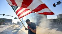 Police arrest more than 20 people on first night of curfew in Los Angeles