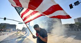 Police arrest more than 20 people on first night of curfew in Los Angeles