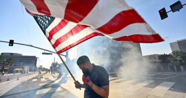 Police arrest more than 20 people on first night of curfew in Los Angeles