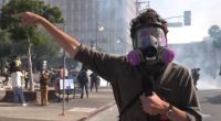Police deploy tear gas at L.A. protest near federal building