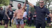 Pictured: UFC star Dan Hooker (left, in baseball cap and singlet) watches as gang member Jon Paul 'Fightdog' Te Rito is awarded a win in his backyard fight fest in Auckland