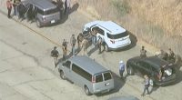 Protest at Dodger Stadium gets underway as immigration agents seen nearby amid reports of more ICE raids in LA County