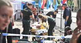 Paramedics attending to a protester injured outside the Iranian embassy.